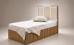- Product: A single bed with a wooden base and upholstered headboard.
- Target audience: Unisex (neutral styling suitable for men or women).
- Visible attributes: Light wood frame with a padded headboard featuring vertical paneling and soft lighting. White bedsheets, a matching white/cream bed scarf draped over the foot, and a single pillow placed near the head. Overall aesthetic is simple, contemporary, and minimal.