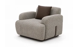 - What it is: A compact, upholstered armchair with a soft, light-brown/taupe textured fabric and a single dark brown throw pillow.
- Intended audience and styling: Unisex seating suitable for living room or lounge areas; contemporary, cushy, family-friendly aesthetic.
- Notable attributes visible: Rounded, padded armrests and back, low square legs (dark base), and a clean, neutral weave fabric. Color is a light taupe with a contrasting dark brown cushion. Material appears to be woven upholstery fabric.