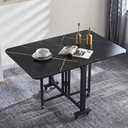 - What the product is: A foldable dining table with a black marble-pattern top (120×80 cm) and a sturdy metal frame. It appears set in a living area with two bottle decor items, a cup and saucer, and a magazine.
- Intended audience: Unisex; suitable for both men and women, with a modern, minimalist dining or work setup.
- Notable attributes: Black tabletop with subtle gold/light veining pattern, rounded corners, foldable/extendable design likely for compact storage, black metal legs with cross-supports for stability, contemporary style. Color: black with gold-veined marble look. Material cues: faux marble-like laminate top, metal frame.