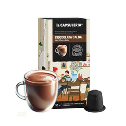 A chocolate-flavored hot beverage in Nespresso-style compatible capsules. The image shows a box labeled “Cioccolata Calda / Hot Chocolate” with 10 capsules, alongside a prepared cup of steaming hot chocolate and a single capsule with its cap. The design suggests a unisex audience, with warm brown tones and a cozy café-style illustration on the packaging, highlighting a rich cocoa color as the main feature.