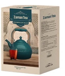 - Product: A box of Zaman Tea, 100 gm. The front shows a teal teapot with a glass of tea placed on a wooden surface, set against a textured, beige background.
- Audience and style: Unisex look; traditional, artisanal tea styling with a teal color palette and ornate teapot, suggesting premium dust tea.
- Notable attributes: Teal ceramic teapot image, wooden surface, glass of brewed tea, boxed packaging with teal label "Zaman Tea" and decorative arch motif. No brand names beyond the product label; material highlighted visually is tea/dust tea packaging.