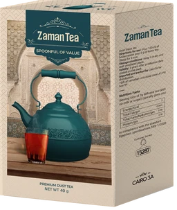 - What the product is: A box of Zaman Tea premium dust tea (40 g), featuring a teal-colored kettle with a glass of brewed tea on the front.
- Intended audience: Unisex (the packaging and styling are neutral for broad consumption).
- Notable attributes visible: teal/dark turquoise color scheme, ornate teapot illustration, Arabic and English branding, traditional/heritage aesthetic, “Premium Dust Tea” and “NET WT 40 g” visible, decorative arch background.