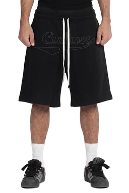- What the product is: A pair of black athletic shorts with a drawstring waist and knee-length cut, shown being worn by a male model.
- Intended audience: Men’s (judging by the model fit, length, and styling).
- Notable attributes: Black fabric with a white drawstring, mid-thigh to knee-length inseam, relaxed/sporty fit, lightweight material; model is wearing white crew socks and black sneakers for a casual athletic look. No branding visible.