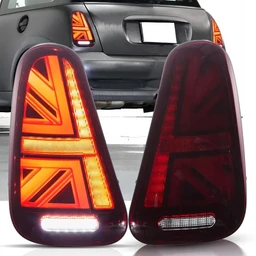 - What the product is: A pair of Euro-style LED tail lights for Mini Cooper R50/R52/R53 (2001–2006). The left unit is lit with bright orange LEDs forming a Union Jack pattern; the right unit is shown unlit with red LEDs outlining the same Union Jack design.
- Intended audience: Unisex, as these are aftermarket car parts suitable for Mini Cooper enthusiasts.
- Notable attributes: Black lens housing with prominent Union Jack LED configuration, bright orange turn/accents on the lit unit and red illumination on the unlit unit, integrated horizontal white/clear reflector at the bottom. Style is bold, modern, and sporty. Material appears to be plastic lens with LED array technology.