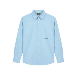 A light blue Oxford shirt with a classic button-down front and long sleeves. Designed for men, judging by the cut and sizing silhouette, with a small embroidered script on the left chest for a subtle detail. Notable attributes include the breathable cotton oxford weave, pastel blue colour, and a traditional collar with white buttons.