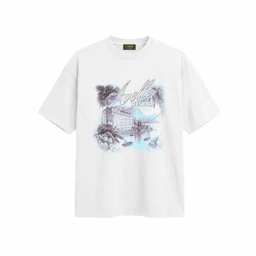 A white short-sleeve graphic tee featuring a pastel-toned print of a coastal resort scene with palm trees and a body of water, overlaid with script-style text. Intended for a unisex or casual market, with a relaxed fit and standard crew neckline. Notable details include a light blue and purple color palette, island-inspired illustration, and a soft cotton fabric appearance.