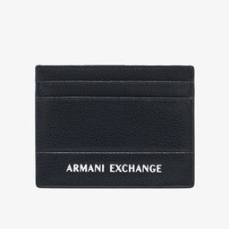 This is a compact card holder in black pebbled leather. It features two horizontal card slots on the front and a small center divider area, with the text “ARMANI EXCHANGE” in white on the lower front. Appears designed for men, with a slim, minimalist style and a matte textured finish. Notable materials: pebbled leather; color: black; style: minimalist card wallet.