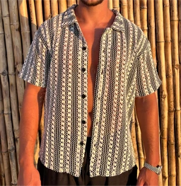 A short-sleeve button-up shirt with a black-and-white vertical stripe pattern. The shirt is worn open over dark shorts by a male-looking model, suggesting a casual beachy or vacation style for men. Visible attributes: lightweight woven fabric, short sleeves, open collar, front button placket with dark buttons, and a relaxed, loose fit. No visible branding.