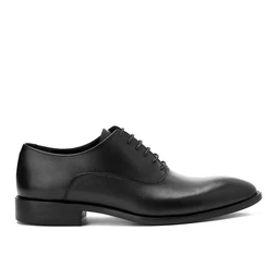 This is a black leather oxford shoe with a classic plain toe and closed-lace design. Appears sized for men, featuring a low heel and smooth, polished upper with minimal stitching details. Notable attributes include the full-grain leather look, slim lace stay, and sleek, formal dress-shoe styling.