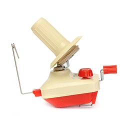 This is a compact yarn winder device designed for hand-use, intended for hobbyists and crafters who work with yarn for tufting or knitting. It appears unisex in use, with a beige and red plastic body, a large adjustable knob, a small clamp arm, and a metal spindle/holding rod for guiding yarn; the visible materials are plastic housing with metal components. The styling is utilitarian and retro in color, focusing on function rather than fashion, suitable for home craft setups.