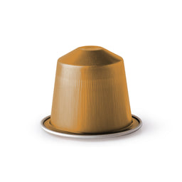 A single-use coffee capsule in a metallic gold/brown foil wrapper sits on a small silver ring, likely designed for a compatibility-compatible espresso machine. The capsule has a pointed top and smooth, slightly brushed surface with vertical ridges visible on the foil. Intended audience appears unisex, with a compact, single-serve style and a warm, bronze-gold color and sheen.