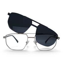 - What the product is: A clip-on sunglasses accessory featuring a dark, rectangular-lens shield that sits over standard eyeglasses, forming a two-piece set.
- Intended audience: Unisex, likely for adults, given the neutral metal frame and classic style.
- Notable attributes visible: A pair of rimless, rectangular metal eyeglasses with clear lenses; a separate dark, curved clip-on shield with a small mounting notch and cut-out design to fit over the glasses. The overall look combines sleek silver frames with a black/blue-tinted clip-on lens.