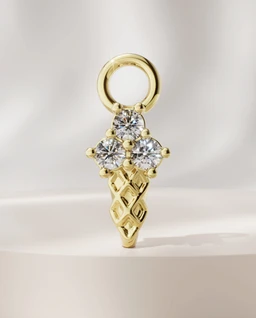 - What it is: A small ice-cream cone charm pendant in gold-tone metal with sparkly stones. It features a circular loop at the top for attachment.
- Intended audience: Unisex (suitable for both men and women who wear charms, based on size and style).
- Visible attributes: Gold-tone finish, waffle cone design with etched diamond-like pattern, three clear gemstone accents arranged like a scoop cluster, and a round jump ring for chain or bracelet attachment.