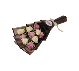 A small bouquet of pastel roses arranged with white and pink blooms, wrapped in dark tissue and black ribbon. Judging by the styling, the target audience is unisex (giftable) but commonly oriented toward women. Notable attributes: soft pink and creamy white roses, dark wrap with a light ribbon, compact bouquet with a short stem presentation.