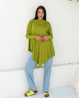A loose, asymmetrical summer top in olive green with a draped, layered silhouette. The top has long sleeves and a high, soft crew neck, with an uneven hem that drapes longer at the sides. The model pairs it with light blue straight-leg jeans, suggesting a casual, relaxed-fit look intended for women. Notable materials and attributes visible: soft, lightweight knit or jersey fabric with a smooth finish; solid olive color; relaxed fit with asymmetrical hem and draped front.