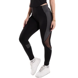 This is a pair of women's athletic leggings with a high-rise waist and color-block panels in black and dark gray. The leggings feature mesh or sheer panel cutouts along the thighs and calves for ventilation and style, paired with light gray/white sneakers shown for scale. Notable attributes include a fitted stretch fabric, contrasting paneling, and a sporty, modern look suitable for workouts.