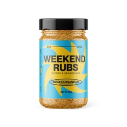 - A jar of Weekend Rubs Mediterranean BBQ Rub in a go-big size. The label is bright blue with yellow palm-like shapes and bold black text; the jar appears to contain a coarse, golden-brown spice mix and has a black screw cap.
- Appears unisex/appropriate for general cooking use (no gender cues from model or packaging). Notable attributes: coarse golden-brown spice, Mediterranean flavor profile, bright decorative label with blue and yellow design, jar labeled as a barbecue spice mix.