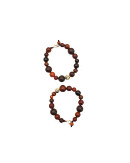 This is a pair of beaded bracelets made with round wood-like brown beads in varying dark to light tones. They are styled for women's or unisex wear, featuring subtle golden-toned accent beads and a small charm near the clasp. The overall look is warm, earthy, and casual with a natural wood bead palette and simple metal findings.