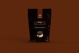 - Product: A dark brown coffee bag labeled “Espresso beans” with a small cup illustration on the front, likely packaging for coffee beans. 
- Audience: Unisex (the packaging and styling are neutral; no gender-specific design elements visible). 
- Notable attributes: Matte dark brown/black packaging with subtle lighter brown accents, small round cup image, text indicating “Espresso beans” and “250 g” on the top, overall minimalistic and modern coffee packaging style.