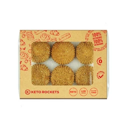 - A box of six round, ridged cookies with a golden-brown baked appearance, arranged in two rows of three. 
- Appears to be a snack targeted to adults or general consumption (unisex) with a keto-friendly branding cue on the packaging. 
- Notable attributes: light brown color, textured, ridged edges, compact rectangular box with “KETO ROCKETS” branding and red printed icons indicating keto/low carb attributes. Packaging uses a kraft-style cardboard with red print and small graphics.
