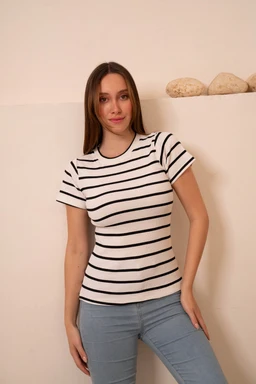 - What the product is: A fitted short-sleeve knit top with horizontal stripes.
- Apparent audience: Women (model styling and fit indicate women's sizing).
- Notable attributes: White base fabric with narrow black stripes, crew neckline, short sleeves, lightweight knit texture, and a slim, casual tee silhouette.