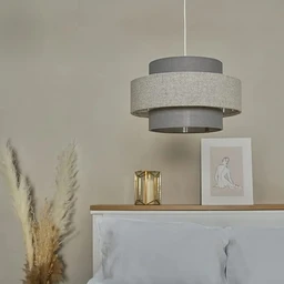 - Description: A ceiling fabric chandelier with a layered, circular drum design in muted gray tones. It hangs from a single cord above a bed with a light wood headboard and neutral bedding.
- Intended audience: Unisex (suitable for general home decor; visual styling is modern/minimal).
- Notable attributes: Fabric shade in two-tone gray, circular multi-layered drum shape, contemporary pendant style, diameter around 75 cm and height around 45 cm as per title, soft neutral color palette.