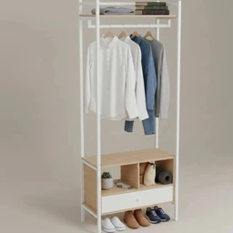 - Product: A freestanding metal and MDF wardrobe organizer with a hanging rail, upper shelf, and lower cubby/drawer unit. The frame is white with light wood-toned MDF elements.
- Audience and styling: Appears unisex, designed for general home use in a bedroom or closet; shown with hanging shirts and jackets, folded items on the top shelf, and footwear in the open cubbies.
- Notable attributes: White metal frame, light wood MDF panels, clothes rail with multiple hangers, upper shelf for folded items, a small open cubby section with decorative items, and a shallow drawer/storage drawer below the cubbies. Overall, a modern, minimalist storage unit with a tall, slim profile.