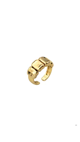 - A gold-toned open-gender jewelry ring featuring chunky, geometric segments reminiscent of link-bracelet styling. 
- Appears designed for adults (unisex or feminine-leaning) based on the bold, fashion-forward silhouette and shine. 
- Notable attributes: polished gold finish, chunky squared links, adjustable/open-gap band with a modern, minimalist style.