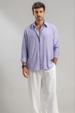 - What it is: A men's linen shirt styled for a casual, relaxed look, shown untucked with light-colored pants for a breezy summer outfit.
- Apparent audience and styling: Men’s, with a loose, unstructured fit and rolled-up sleeves, paired with light, wide-leg or relaxed trousers.
- Notable attributes: Light lavender/lilac linen fabric, long sleeves, button-down front, collar, soft drape, breathable texture, visible casual-sophisticated vibe. No brand names visible.