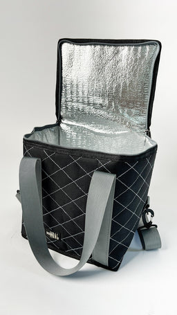 A small to medium insulated tote bag, opened to show its reflective silver thermal lining. It has a quilted black exterior with a diagonal grid pattern and light gray handles, plus a detachable shoulder strap. The design suggests a unisex audience and a 13-liter capacity, with notable features being the insulated interior, sturdy top opening, and practical carry straps.