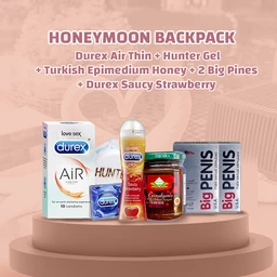 - What the product is: A “Honey Moon Pack” assortment of intimate用品 items arranged on a circular pedestal, featuring a mix of Durex condoms, lubricant, a gel, and a jar of honey with branding removed.
- Apparent audience: Unisex (items shown are generic sexual wellness products, suitable for couples).
- Notable attributes: Visible items include Durex Air condoms, a small bottle of lubricant/gel, a jar of honey-based product, a small sachet, and two boxes labeled “Big PENS” (likely a storage/packaging element). Color scheme includes white, blue, and pastel tones with pinkish background; packaging shows brands and product types without logos beyond generic design. The overall style is promotional and playful, centered on a honeymoon/romantic theme.