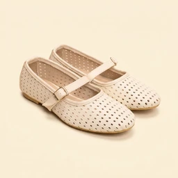 - Product: Perforated Mary Jane shoes in beige. 
- Audience: Women (based on styling and classic Mary Jane cut). 
- Notable attributes: closed, rounded toe with evenly spaced perforations, beige/cream color, with a single strap and small buckle across the instep, flat sole. Visible material appears to be light, possibly faux leather or perforated leather-like upper.