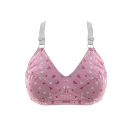 A soft, pink cotton push-up style bra with a hearts print. Appears designed for women, featuring structured cups, white adjustable straps, and seam details for light support. Notable attributes include a pink base color with small heart patterns, white straps with metal adjusters, and a comfortable cotton fabric look.