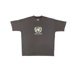 This is an oversized short-sleeve t-shirt in a dark charcoal/gray color. It appears designed for a unisex or unisex-at-heart fit, with a boxy, roomy silhouette and a small graphic on the chest featuring a circular emblem and the text “USELESS NATIONS.” The visible styling is minimal, with a centered white print and a lightweight cotton jersey look.