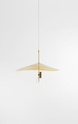 - A pendant light with a slim suspension cord and a flat, circular brass shade in a warm hammered brass finish.
- The visible model is unisex in styling; based on proportions and neutral fixture design, intended for general interior use.
- Notable visible attributes: small suspension length, minimalist disk/shade shape, hammered brass surface, central mounting attachment with a small pull-down/cord loop, soft warm metallic color, clean white background.