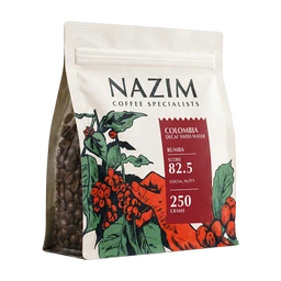 - What the product is: A bag of Nazim coffee beans labeled as Colombia Decaf Swiss Water, shown in a stand-up pouch with a clear side to view whole beans.
- Intended audience: Unisex (suitable for adults regardless of gender), based on the neutral packaging and home-use coffee presentation.
- Notable attributes visible: White/g cream-colored resealable bag with a colorful Colombian coffee plant illustration; red label indicating Colombia decaf Swiss Water, and details like roast level and weight (250 grams) visible on the front; dark roasted coffee beans visible through a transparent side window. Style is premium, specialty coffee packaging with botanical artwork.
