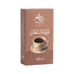 - What it is: A box of Turkish coffee package featuring a brown, rectangular carton with a cup of coffee illustration on the front.
- Intended audience: Unisex (appears suitable for adults of any gender).
- Notable attributes: Brown-taupe color scheme, stylized coffee cup illustration, white Arabic script and branding text, box tilted upright with side panel visible. The packaging suggests a traditional Turkish coffee blend with a warm, rustic aesthetic.