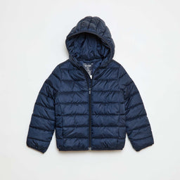 A navy-blue lightweight padded jacket with a quilted, horizontal baffle design and a hood. It appears sized for kids or teens, based on proportions and cut, with a full front zip and elasticized cuffs for a snug fit. Notable attributes include the shiny synthetic padding, bright navy color, and casual puffer style suitable for cool weather.