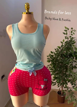 - Product: A women's pajama set (shorts and sleeveless top). The top is a light turquoise/seafoam tank top, tied at the waist. The shorts are bright pink with white polka dots, featuring a Hello Kitty graphic and small bow accents.
- Audience and styling cues: Intended for women; playful, bedtime/lounge wear with a cute, cartoon character theme.
- Materials and colors: Light, soft knit fabric impression for the top; pink polka-dot shorts with white polka dots, light blue waist tie, and Hello Kitty character graphic. Overall style is casual, kawaii, and cozy.