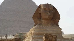 - What the product is: A photo card or poster featuring an ancient Egyptian scene with a prominent Sphinx and pyramids in the background.
- Apparent intended audience: Unisex, suitable for general travel or history enthusiasts.
- Notable attributes: The image shows sandy brown tones, ancient monuments (Sphinx and pyramids), and a desert landscape with a pale sky. The styling suggests a travel or cultural tour theme. No branding visible.