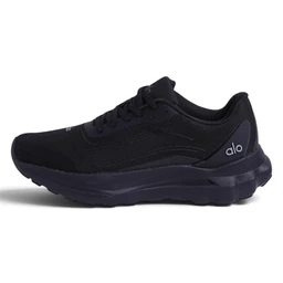 This is a black athletic sneaker with a low-cut upper and lace closure, designed for everyday wear and lightweight comfort. The model’s styling appears unisex, suitable for men or women, with a streamlined, breathable mesh upper and a thick cushioned sole. Notable attributes include a dark monochrome colorway, layered synthetic panels for structure, and a chunky, cushioned midsole and outsole for support.