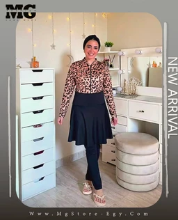 - What the product is: A modest-coverage burkini styled for swimwear, featuring a leopard-print long-sleeve outer top paired with a solid dark skirt/pants combo and matching leggings, presented as a full outfit.
- Intended audience and styling cues: Appears aimed at women, with a fashion-forward, modest look suitable for ages adult; cut includes a fitted leopard-print zippered top and a flared navy skirt over dark leggings, giving a layered, chic beachwear vibe.
- Visible materials, colors, and style attributes: Leopard print fabric for the top, solid navy (or black) bottom pieces, long sleeves, zip closure, knee-to-calf length skirt overlay/cover, and comfortable flat sandals. The overall style is contemporary modest swimwear with a two-piece layered appearance.
