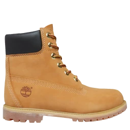 This is a Timber-style rugged boot with a tan leather upper and black padded collar. It features a lace-up front with metal eyelets, a chunky tan sole with tread, and visible stitching along the panels. The boot is styled for a unisex or men’s market, with a sturdy construction and Timber logo embossed on the side.