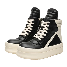 These are high-ankle platform sneakers with a chunky sole. They appear designed for a unisex or trendy fashion audience, featuring black leather or faux leather uppers, cream/ivory laces, and a thick off-white sole with side zipper details. Notable attributes include the chunky platform sole, contrasting light laces, and geometric paneling at the heel for a bold, streetwear style.